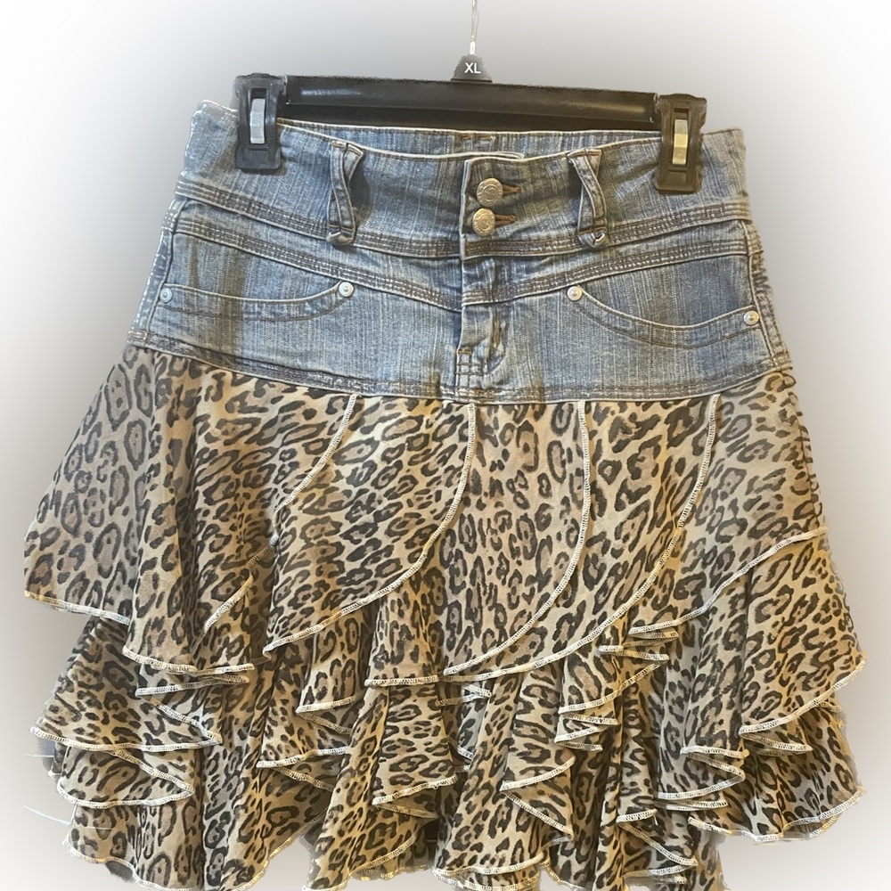 Denim mini skirt w cheetah ruffles.